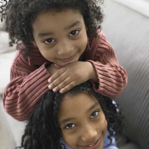 two girls pose for picture